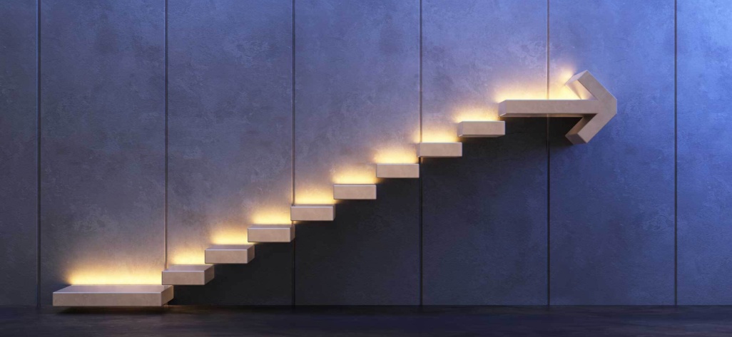 Steps set into a wall with the top step in the shape of an arrow.