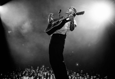 Cian Ducrot on stage black and white