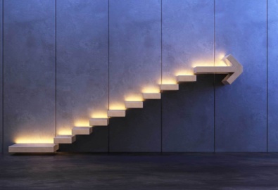 Steps set into a wall with the top step in the shape of an arrow.