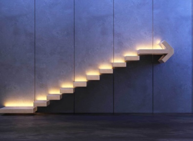 Steps set into a wall with the top step in the shape of an arrow.