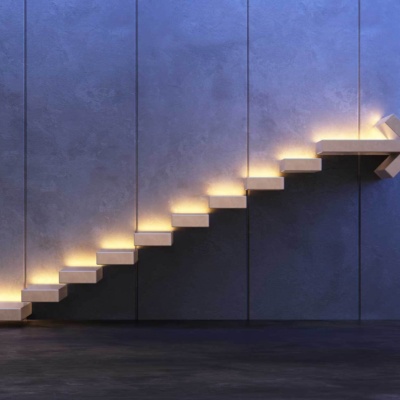 Steps set into a wall with the top step in the shape of an arrow.