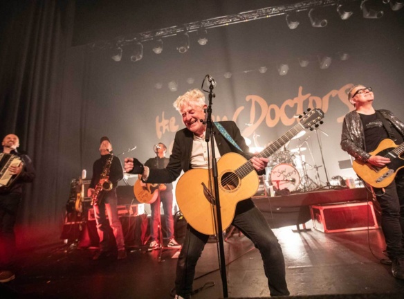 The Saw Doctors performing on stage.